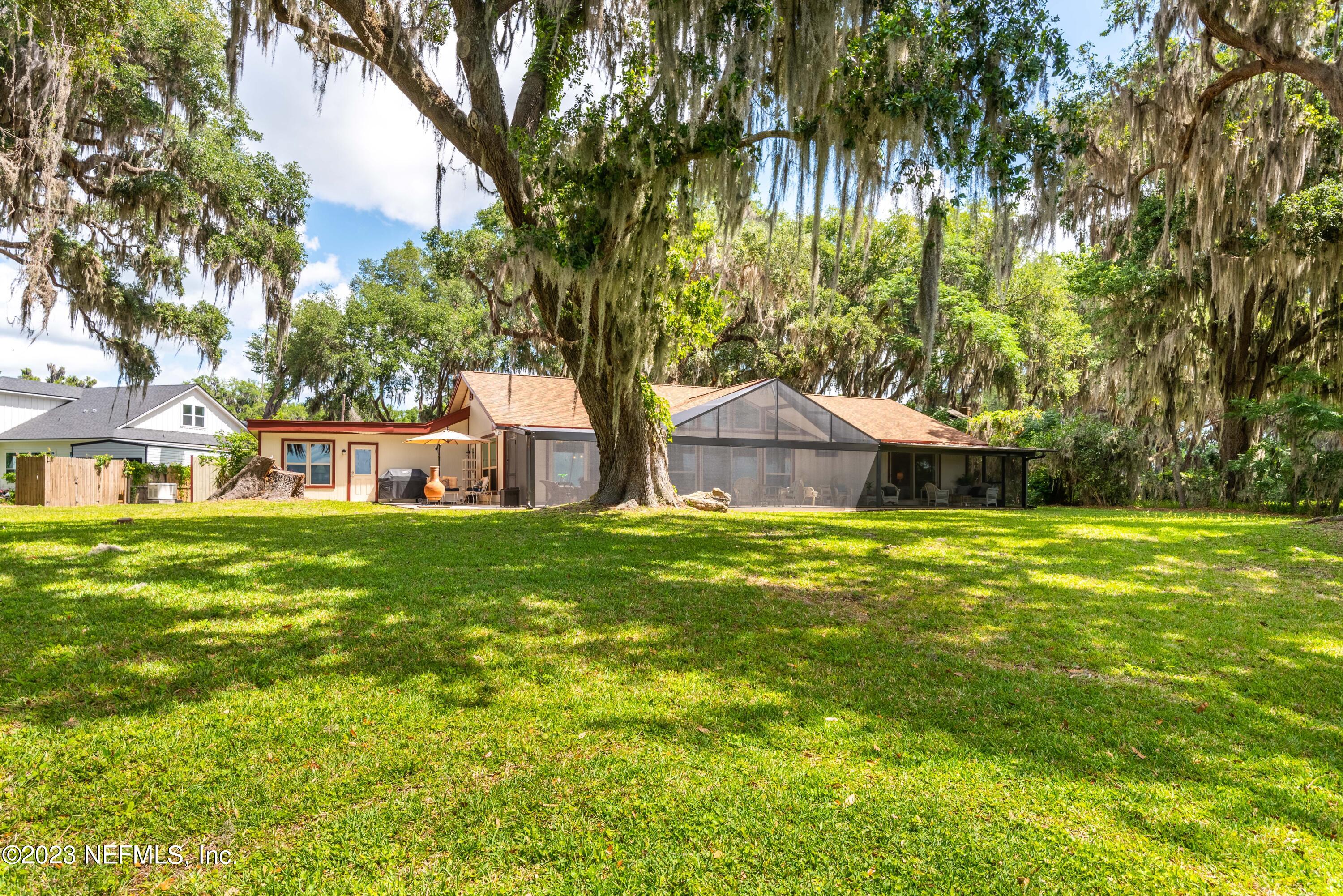 5579 Steamboat Road St. Augustine, FL 32092 - Photo 34 of 52 a front view of a house with a garden