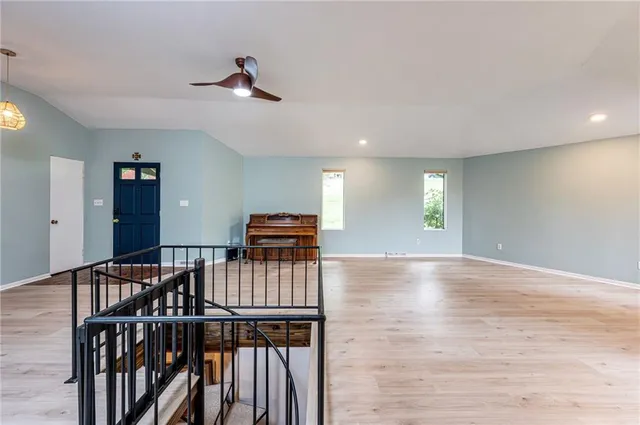 a view of a livingroom with furniture and window