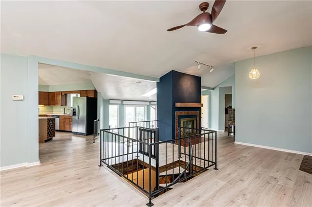 a living room with furniture flat screen tv and a fireplace