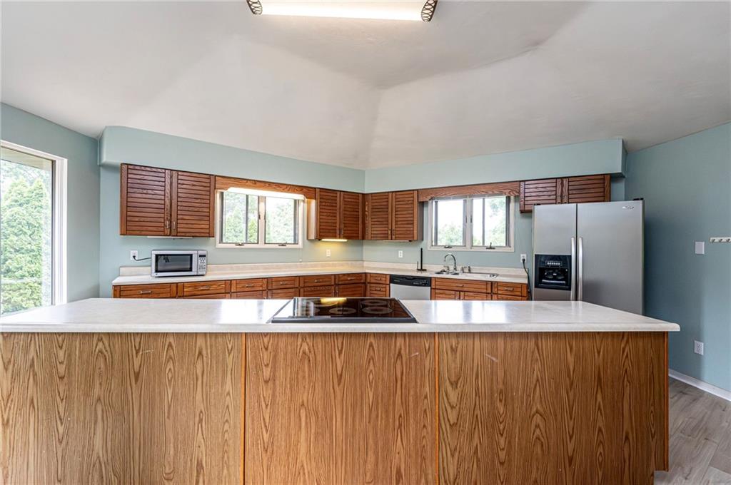 3150 Princeton Road Greensburg, PA 15601 - Photo 16 of 45 a kitchen with granite countertop a refrigerator and a sink