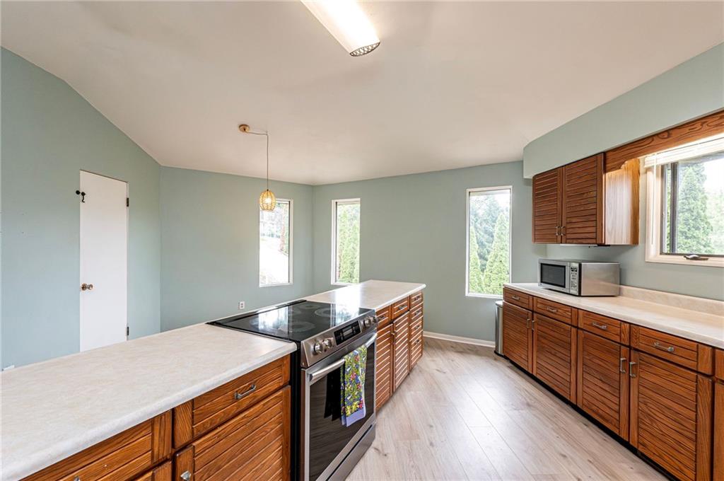 3150 Princeton Road Greensburg, PA 15601 - Photo 20 of 45 a kitchen with stainless steel appliances granite countertop a sink stove and cabinets
