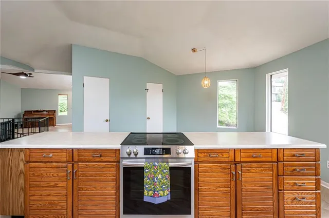 a kitchen with a stove and a cabinet