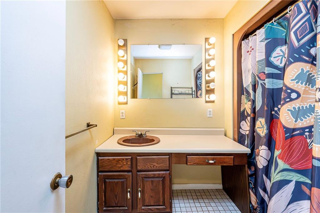 3150 Princeton Road Greensburg, PA 15601 - Photo 29 of 45 a bathroom with a sink and a mirror