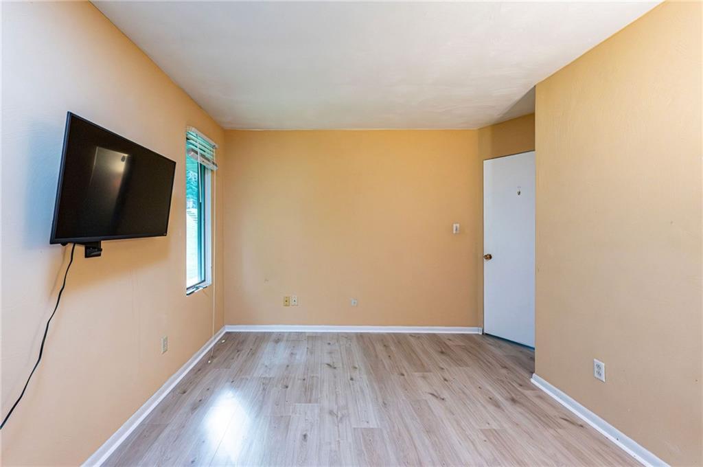 3150 Princeton Road Greensburg, PA 15601 - Photo 31 of 45 a view of room with wooden floor and flat screen tv