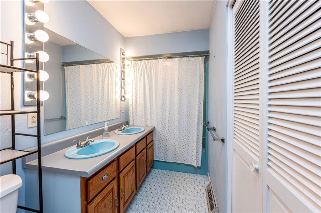 3150 Princeton Road Greensburg, PA 15601 - Photo 34 of 45 a bathroom with a sink a mirror and a shower