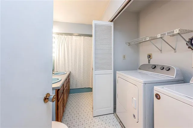 a utility room with dryer and washer