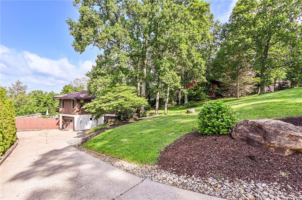 3150 Princeton Road Greensburg, PA 15601 - Photo 4 of 45 a view of a garden with a house