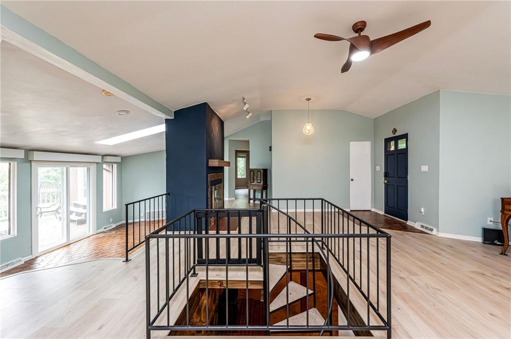 3150 Princeton Road Greensburg, PA 15601 - Photo 6 of 45 a view of a hallway with wooden floor and windows