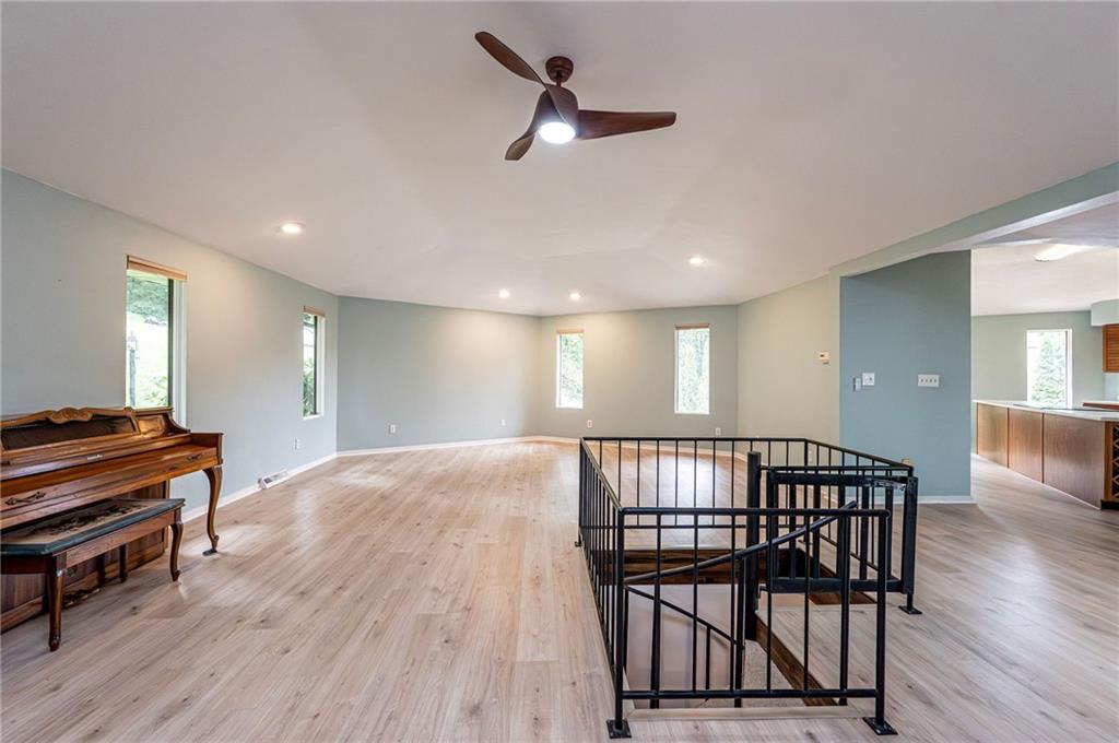 3150 Princeton Road Greensburg, PA 15601 - Photo 7 of 45 a view of a hallway with workspace and wooden floor
