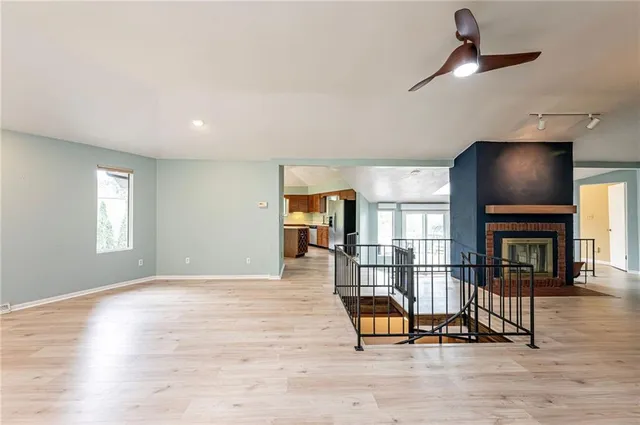 a view of a livingroom with furniture and a fireplace