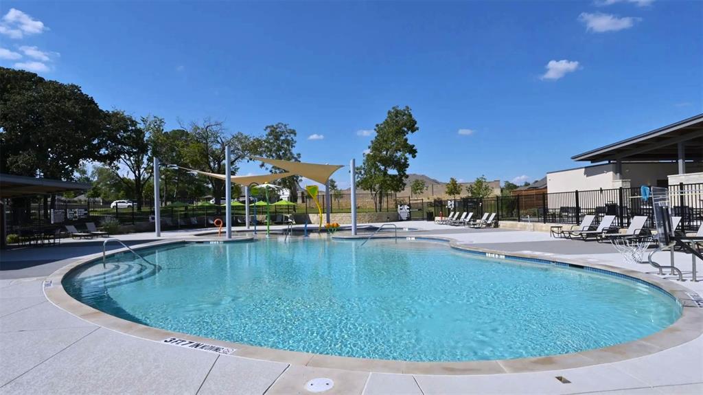 2216 Redwing Drive Denton, TX 76205 - Photo 38 of 38 a view of a swimming pool with outdoor seating