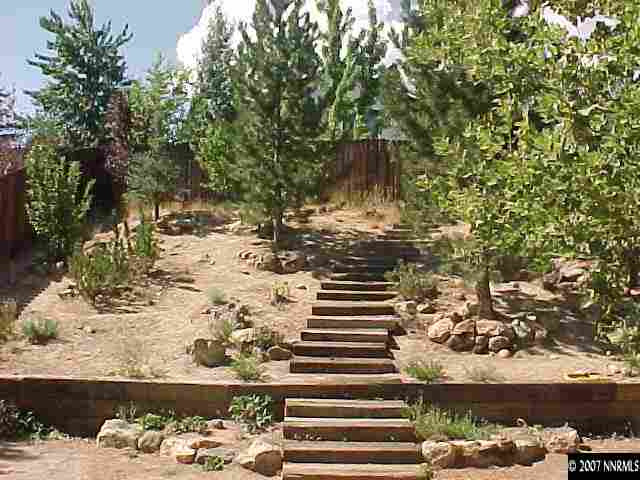 6318 Walnut Creek Road Reno, NV 89523 - Photo 3 of 9 a view of a yard with wooden fence