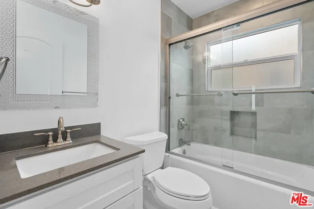 a view of a yard with flower plants