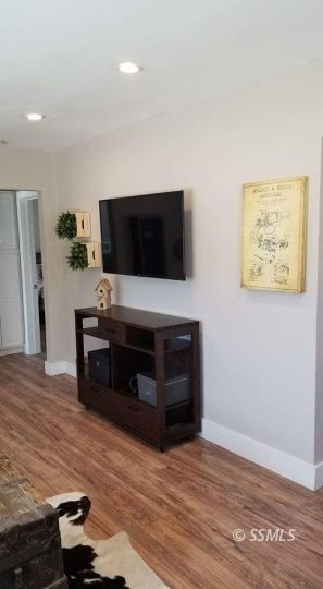 727 North Sanders Street Ridgecrest, CA 93555 - Photo 8 of 27 a living room with furniture and a flat screen tv