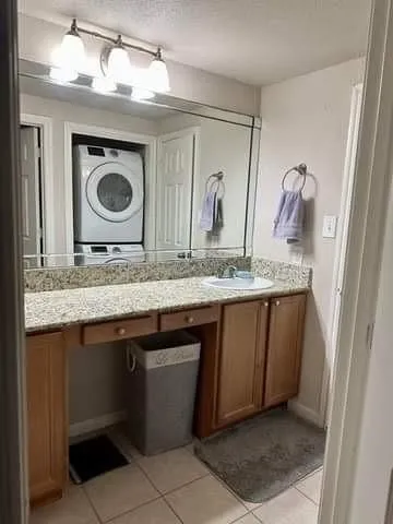 a utility room with a sink a washer and dryer