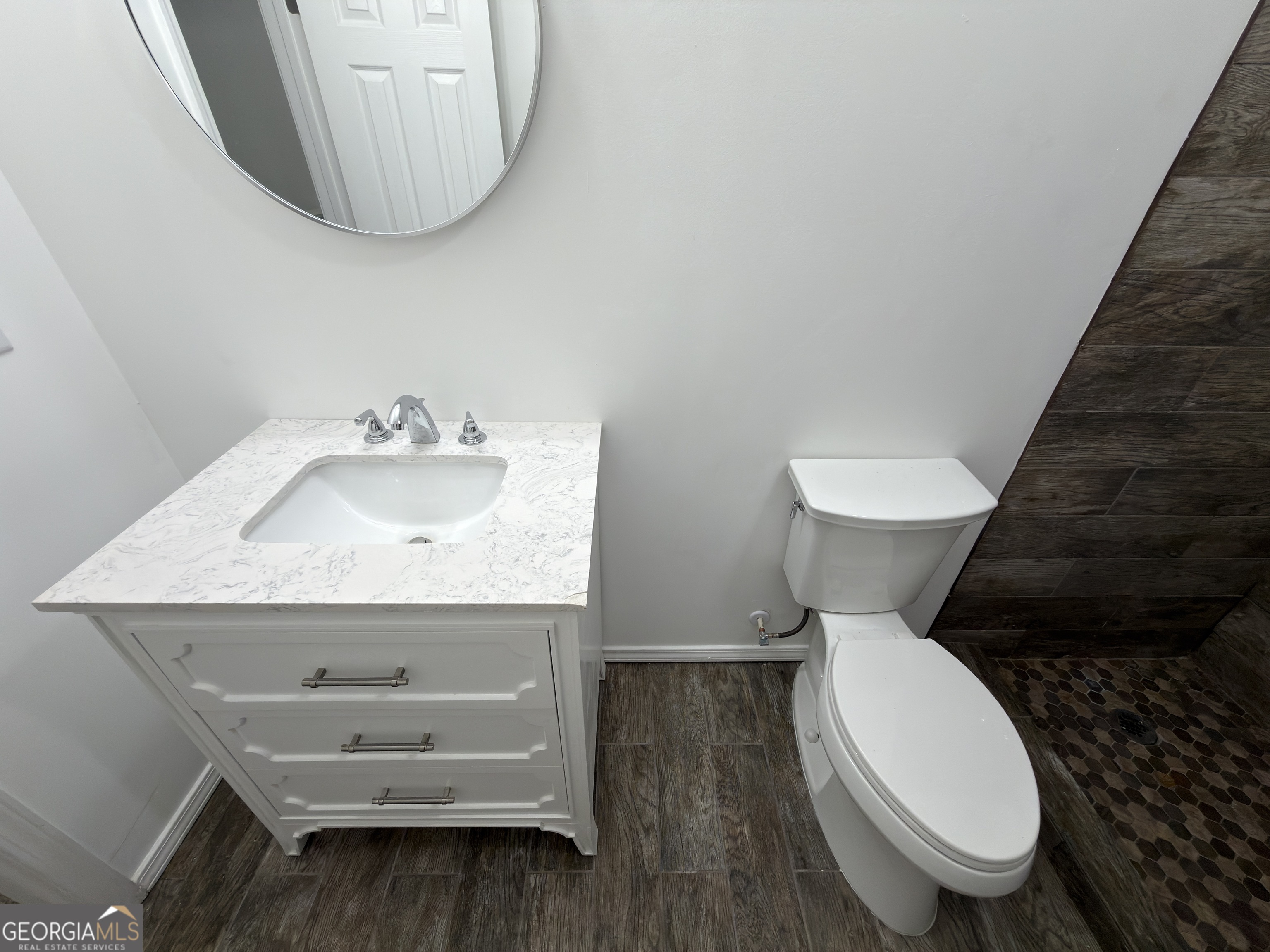 2113 Pine Tree Trail South Fulton, GA 30349 - Photo 14 of 49 a bathroom with a toilet sink and mirror