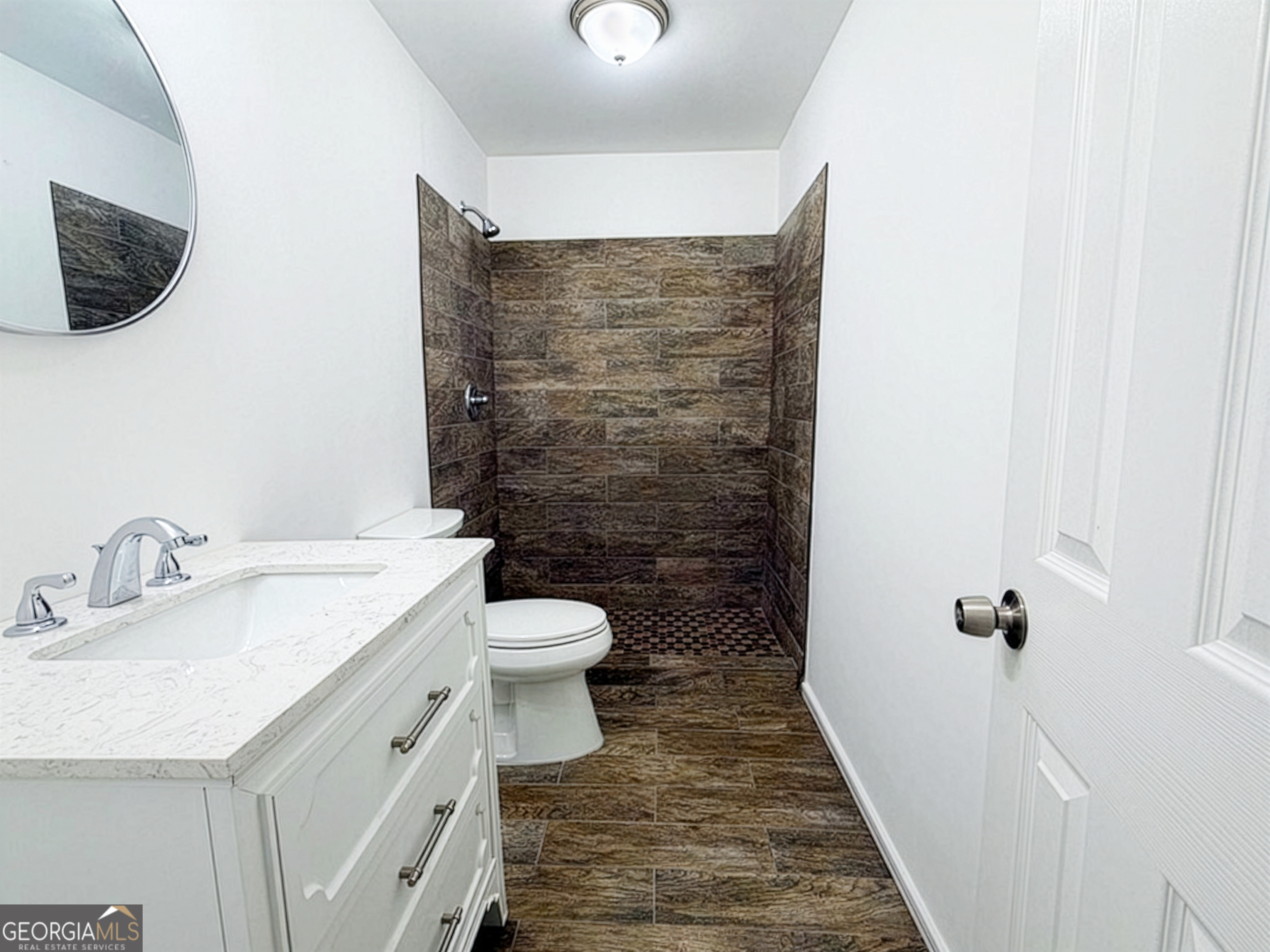 2113 Pine Tree Trail South Fulton, GA 30349 - Photo 18 of 49 a bathroom with a sink and a toilet