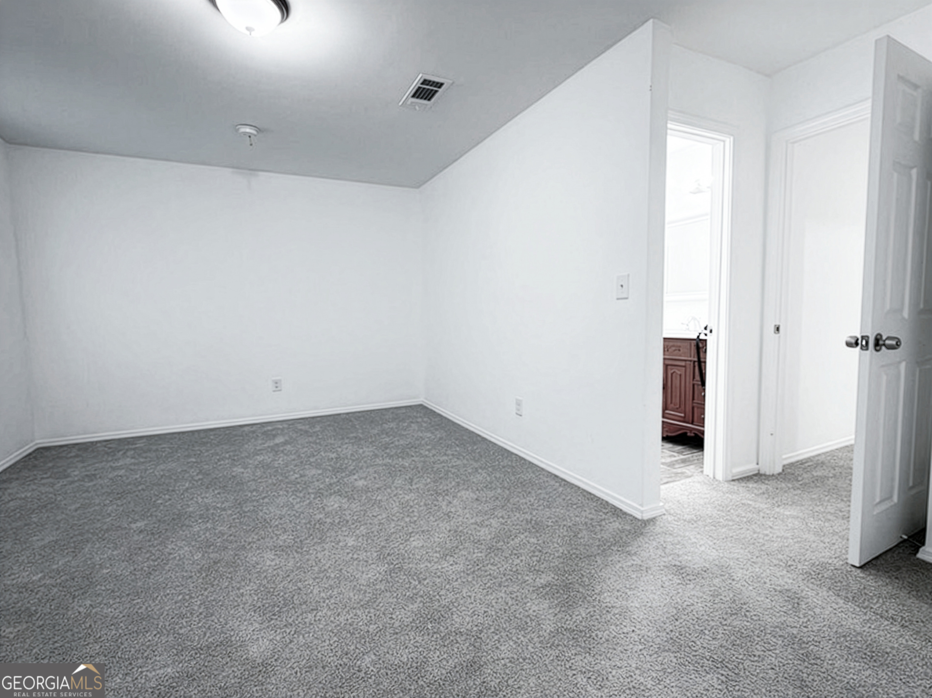 2113 Pine Tree Trail South Fulton, GA 30349 - Photo 19 of 49 an empty room with an entryway