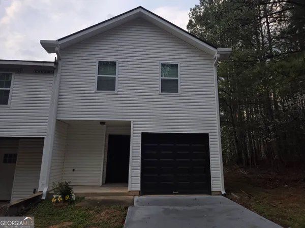 a bathroom with a window and a shower