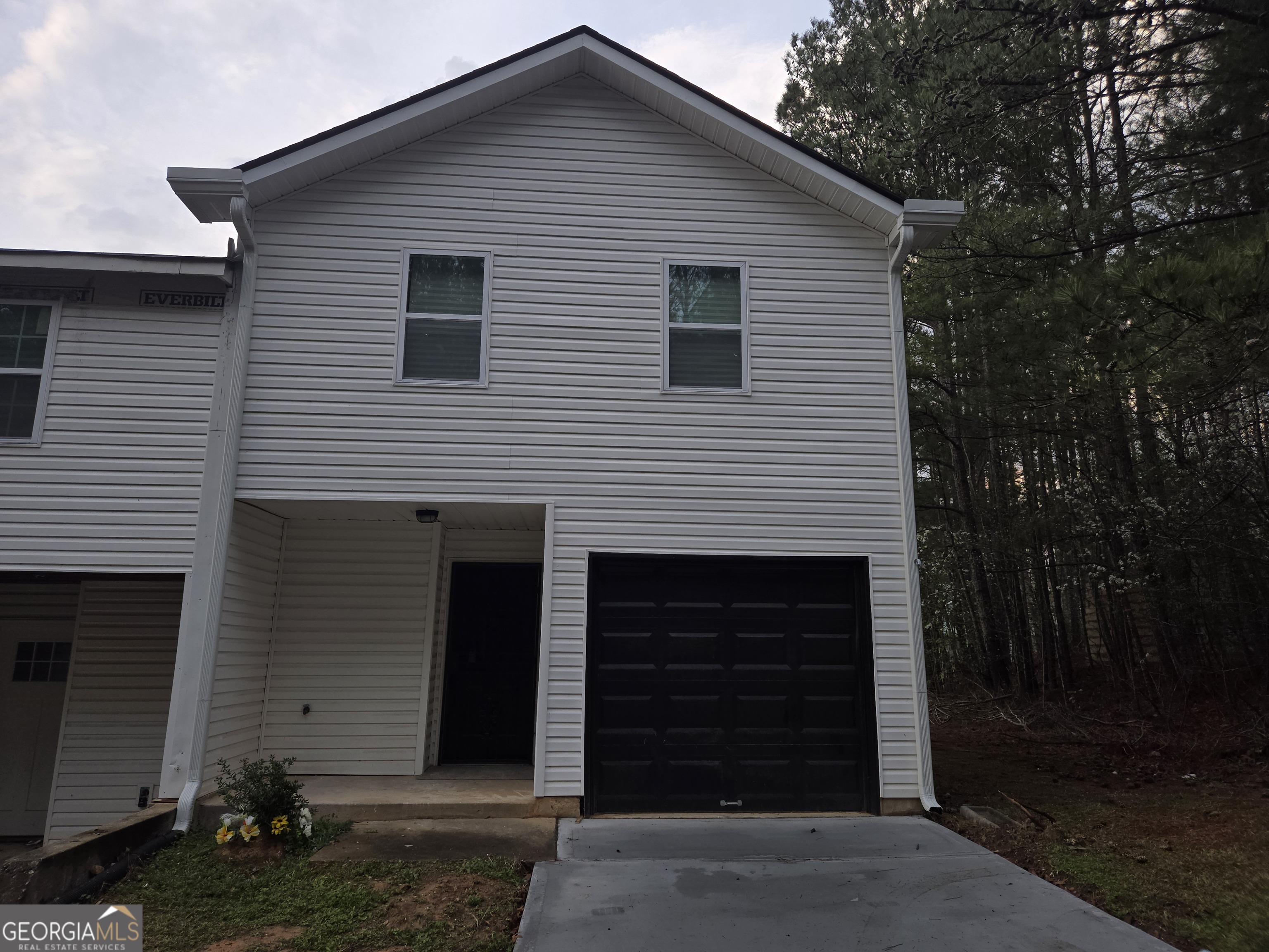 2113 Pine Tree Trail South Fulton, GA 30349 - Photo 42 of 49 a front view of a house with a yard