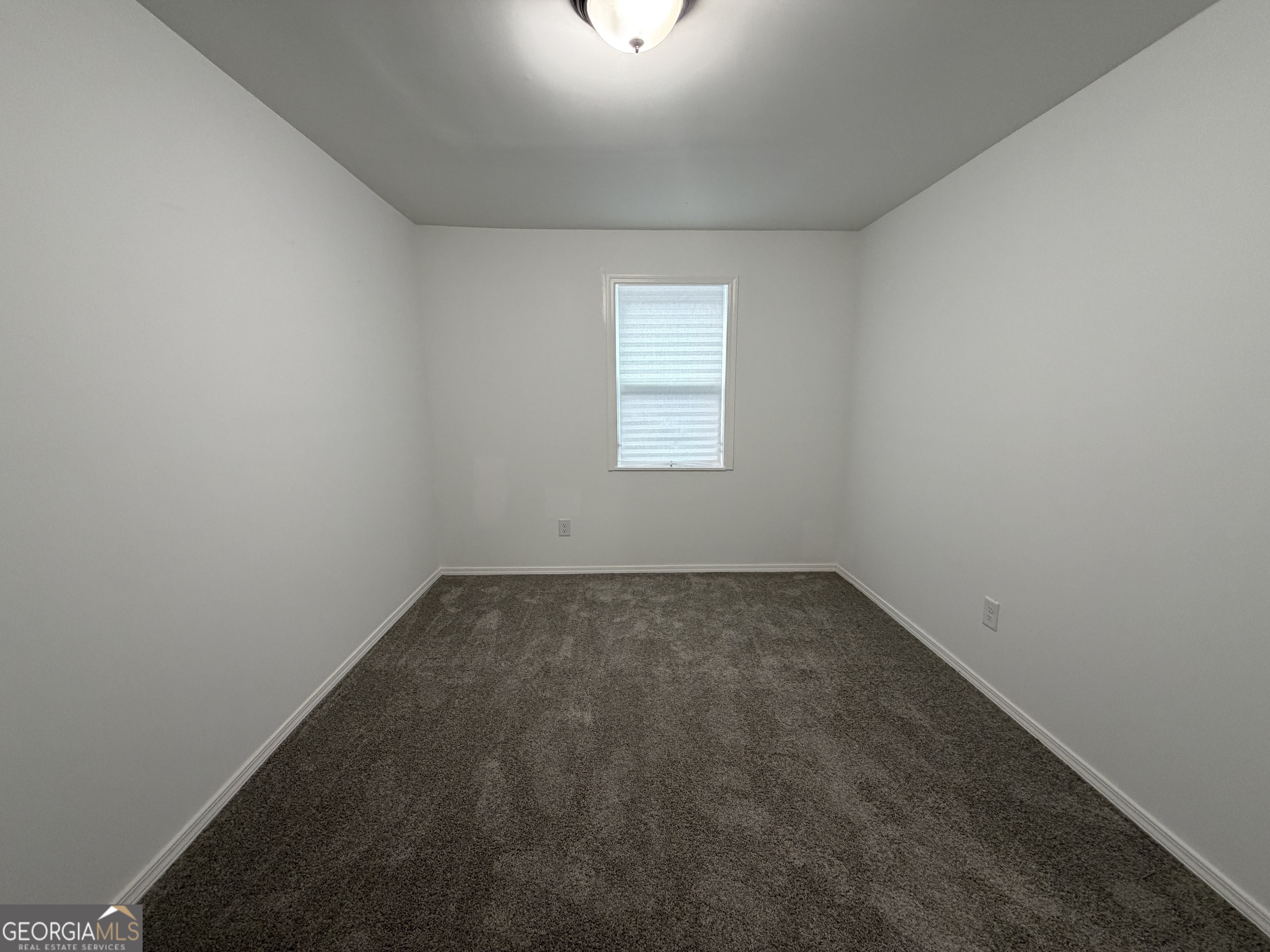 2113 Pine Tree Trail South Fulton, GA 30349 - Photo 47 of 49 an empty room with a window