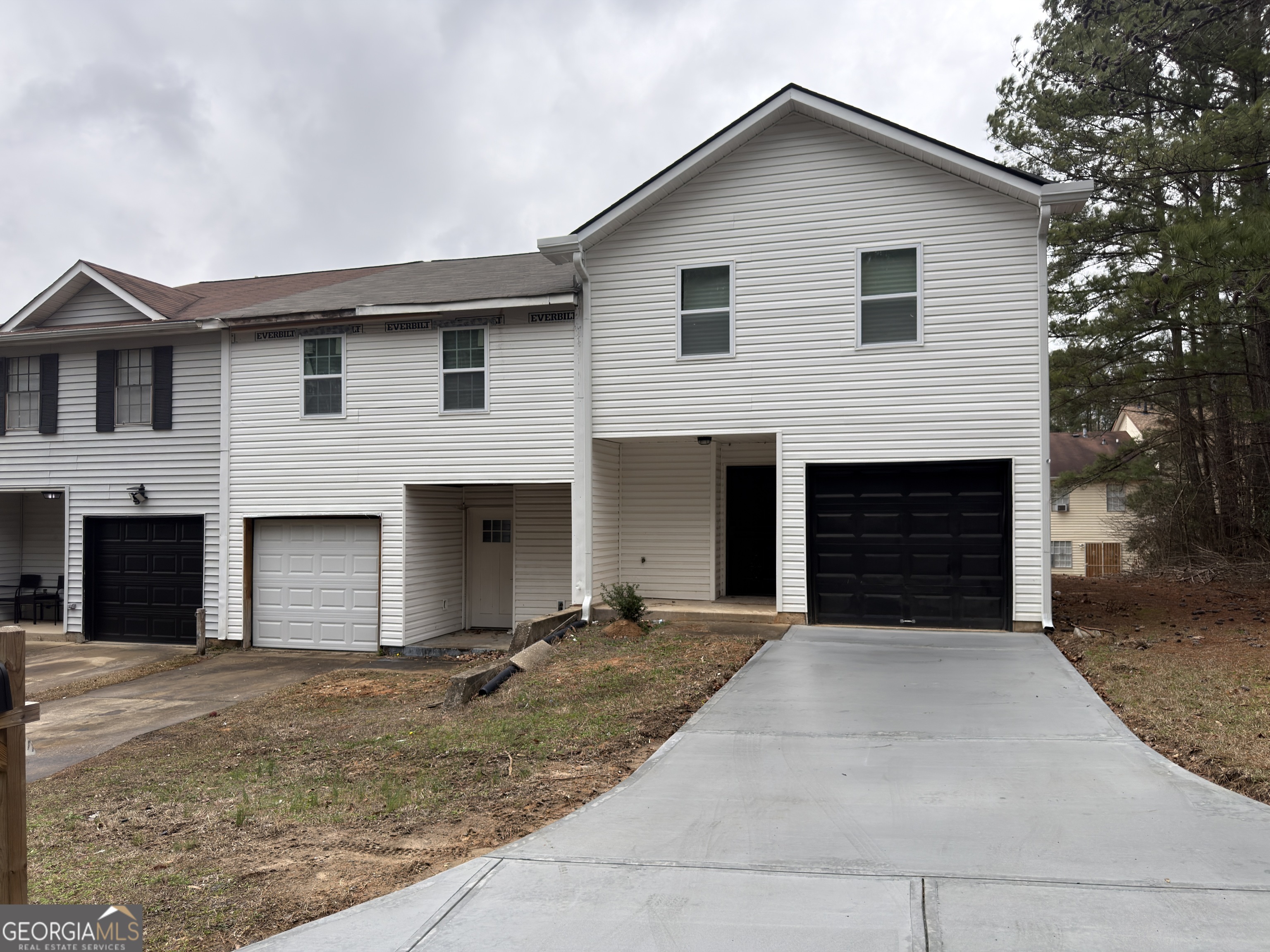 2113 Pine Tree Trail South Fulton, GA 30349 - Photo 49 of 49 a front view of a house with yard and garage