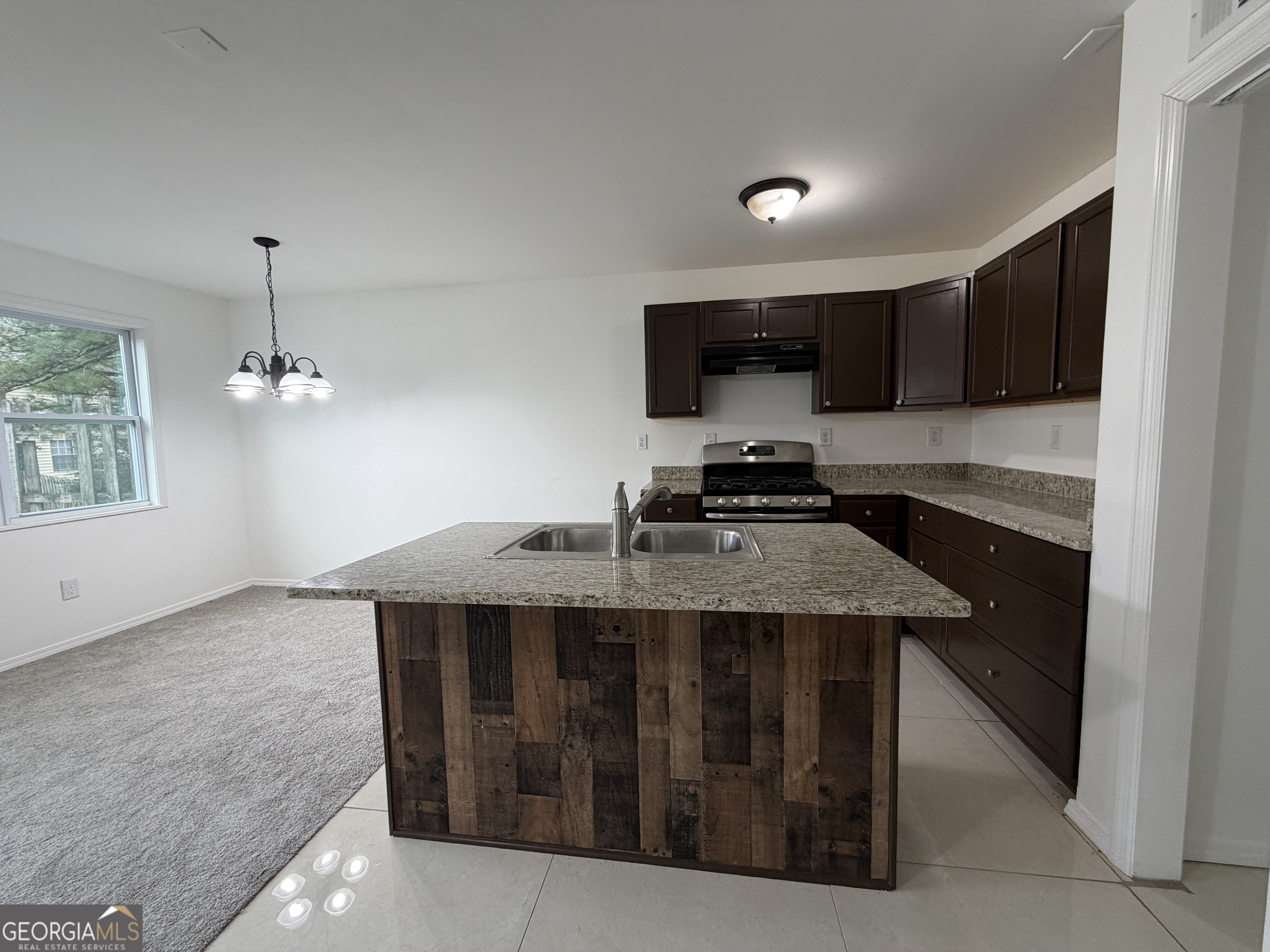 2113 Pine Tree Trail South Fulton, GA 30349 - Photo 6 of 49 a kitchen with a stove and a sink