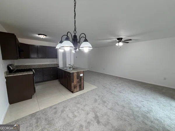 a view of a kitchen with a sink