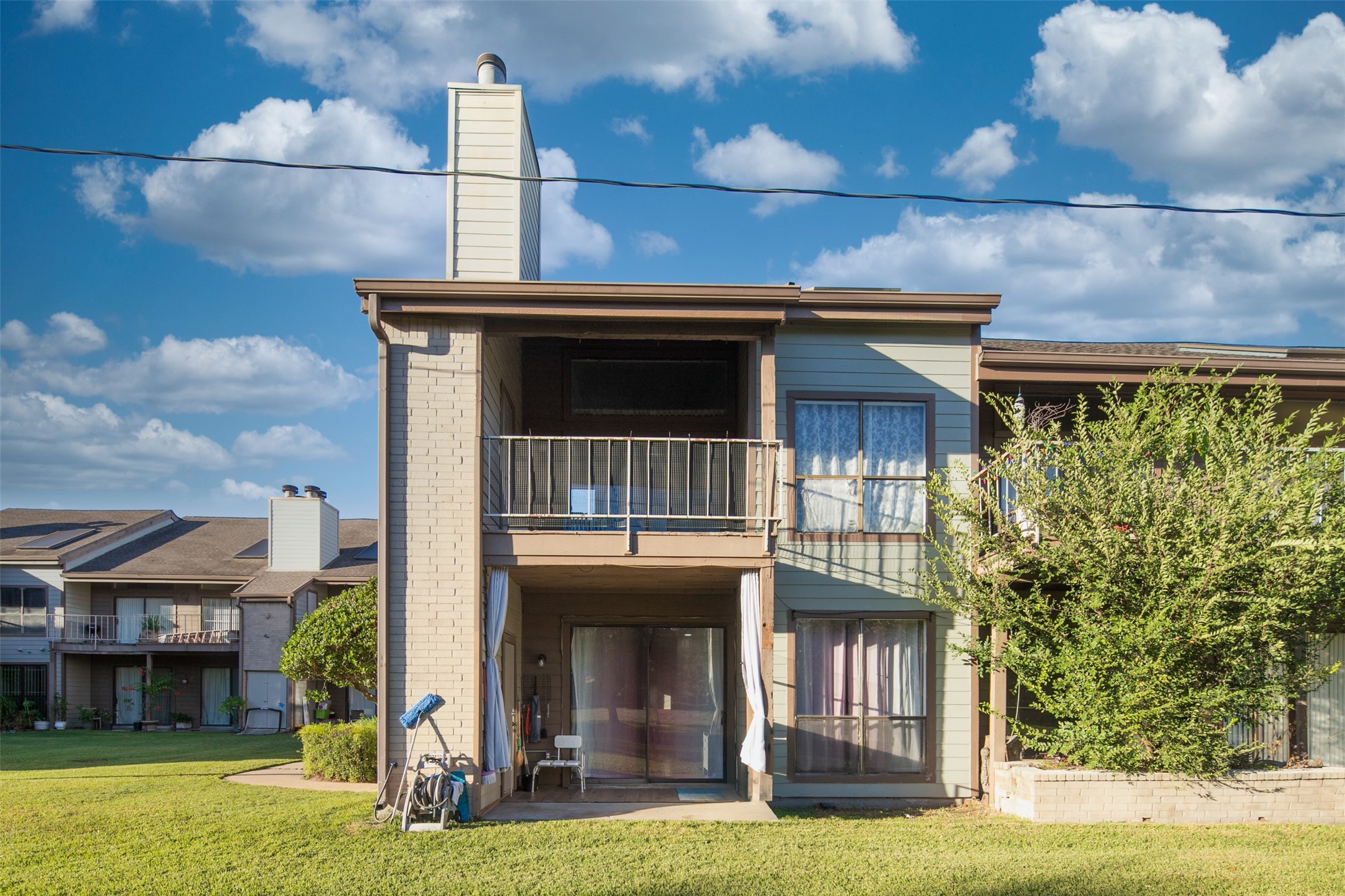 8257 Sands Point Drive, Unit 167 Houston, TX 77036 - Photo 2 of 16 a view of a house with a yard balcony and entertaining space