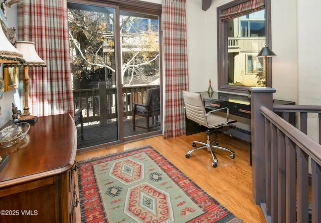 a view of a workspace with furniture