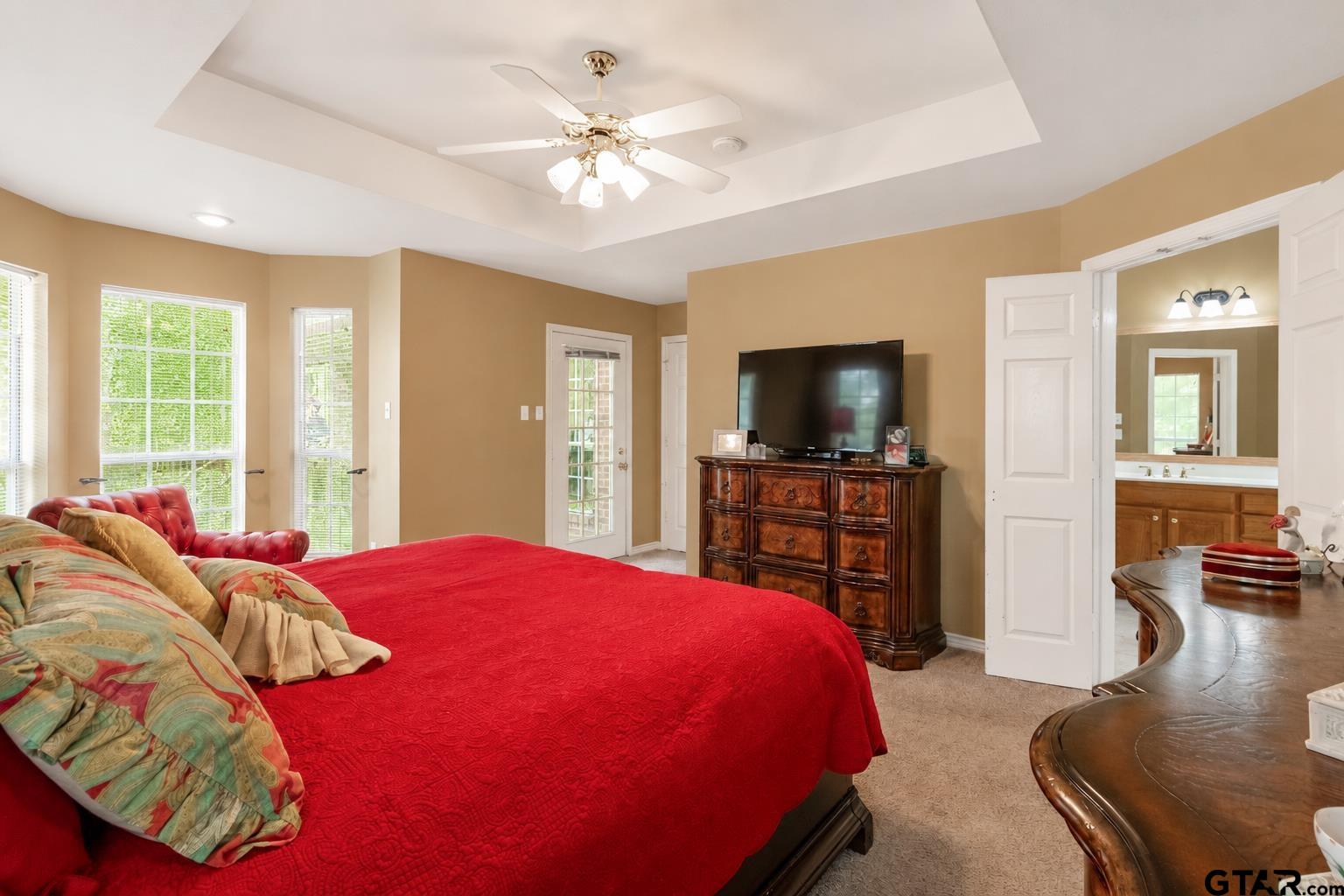 1388 Santa Fe Trail Tyler, TX 75703 - Photo 32 of 46 a bedroom with a bed and a flat screen television