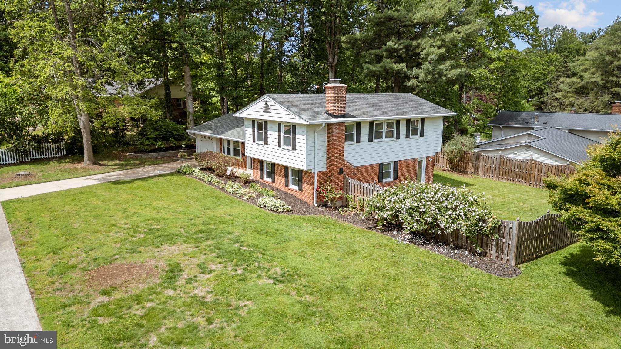 6800 Seton Court Springfield, VA 22152 - Photo 51 of 51 a front view of a house with garden