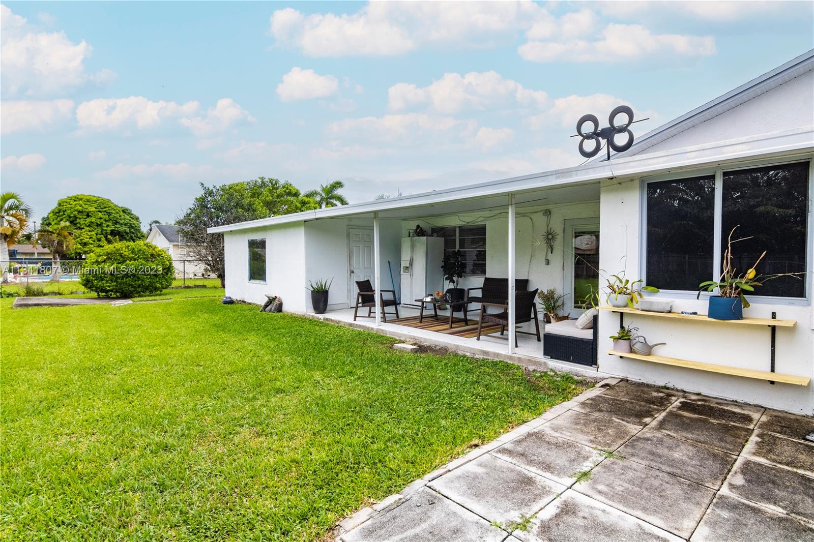 16041 Southwest 284th Street Homestead, FL 33033 - Photo 15 of 20 a view of a house with backyard porch and sitting area