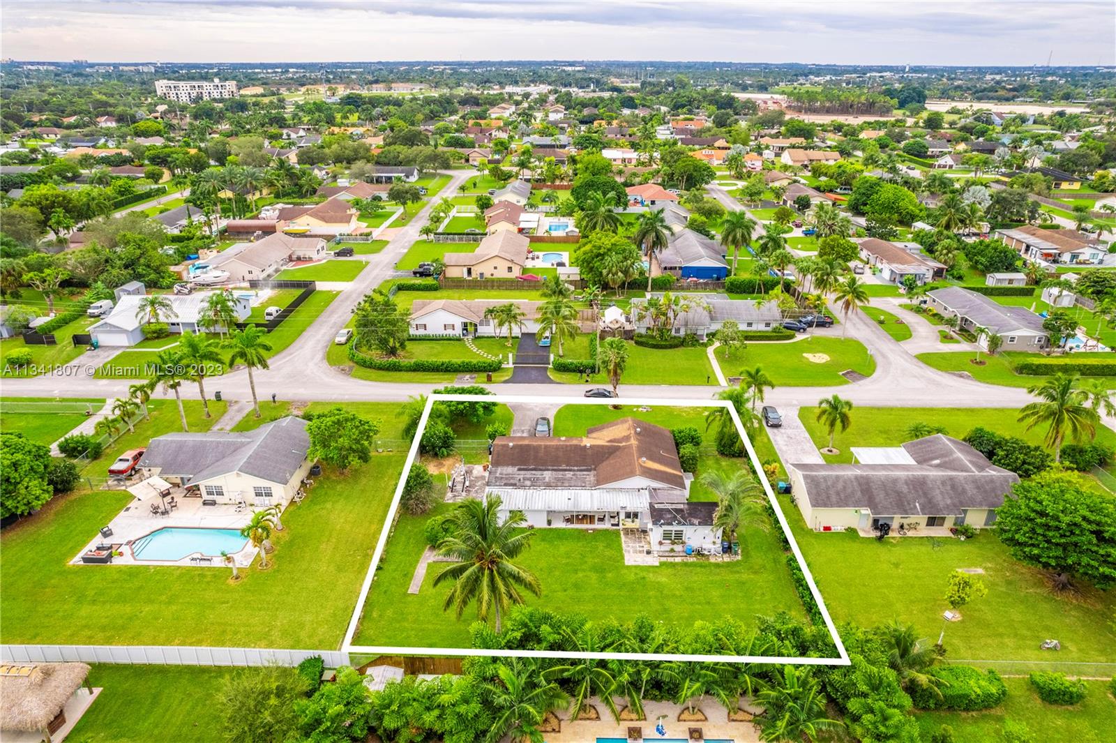16041 Southwest 284th Street Homestead, FL 33033 - Photo 20 of 20 an aerial view of a pool with a yard