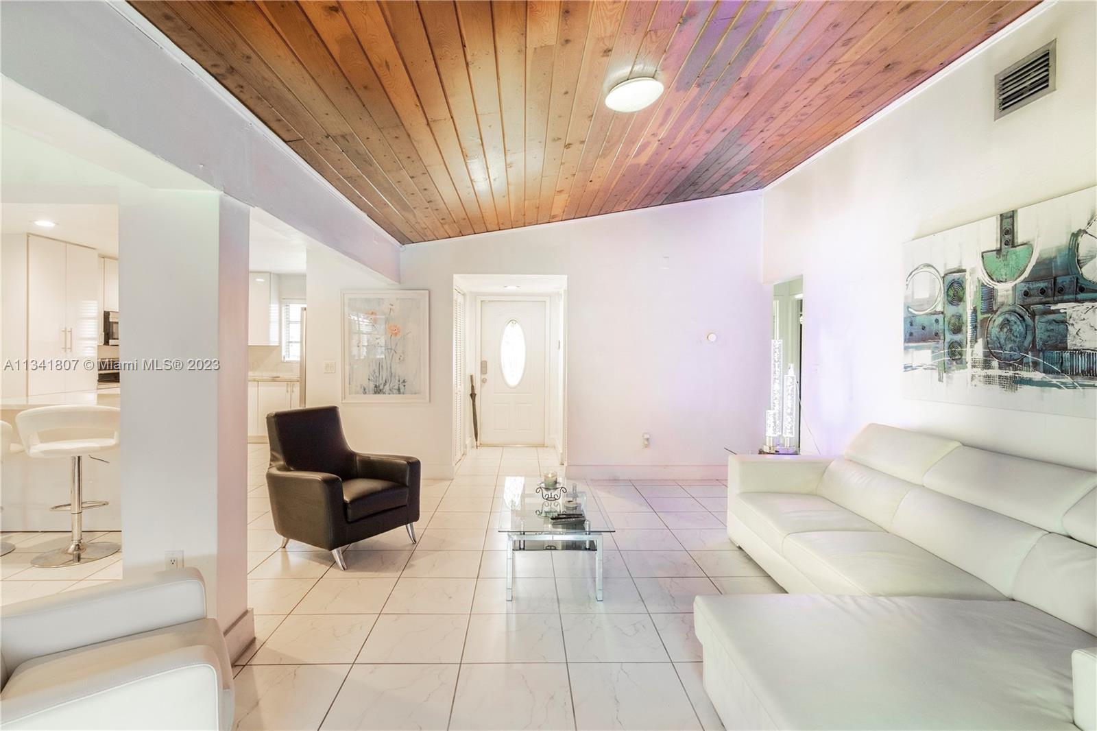 16041 Southwest 284th Street Homestead, FL 33033 - Photo 3 of 20 a lobby with furniture and floor to ceiling window