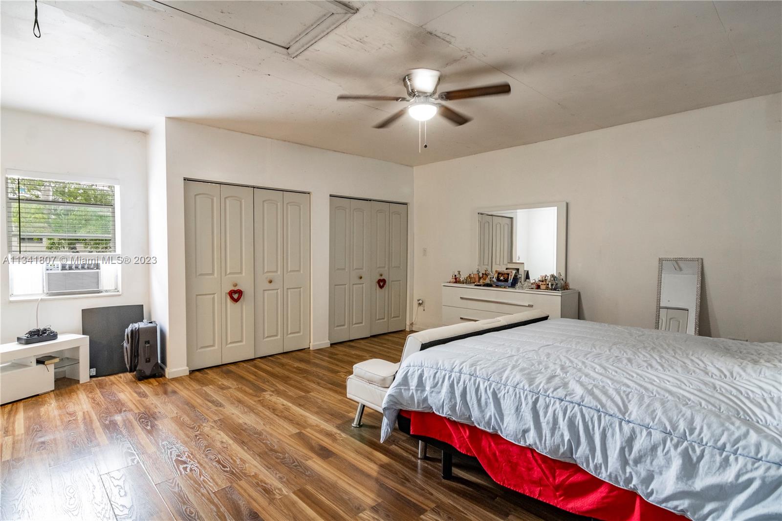 16041 Southwest 284th Street Homestead, FL 33033 - Photo 9 of 20 a bedroom with a bed and wooden floor