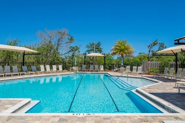a view of a balcony with wooden fence and floor