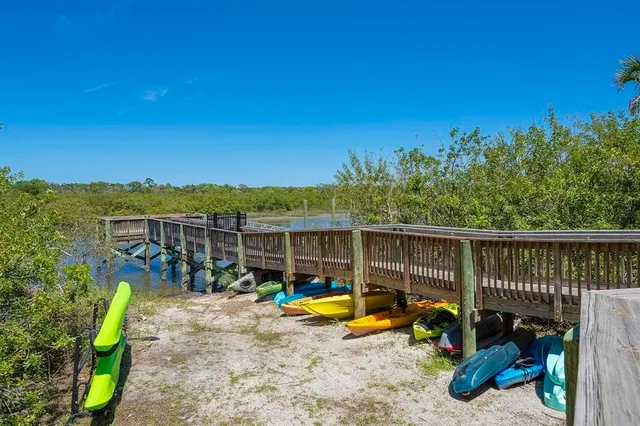 a view of balcony with wooden floor and fence