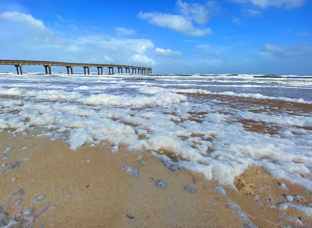 a view of people sitting in front of retail shop