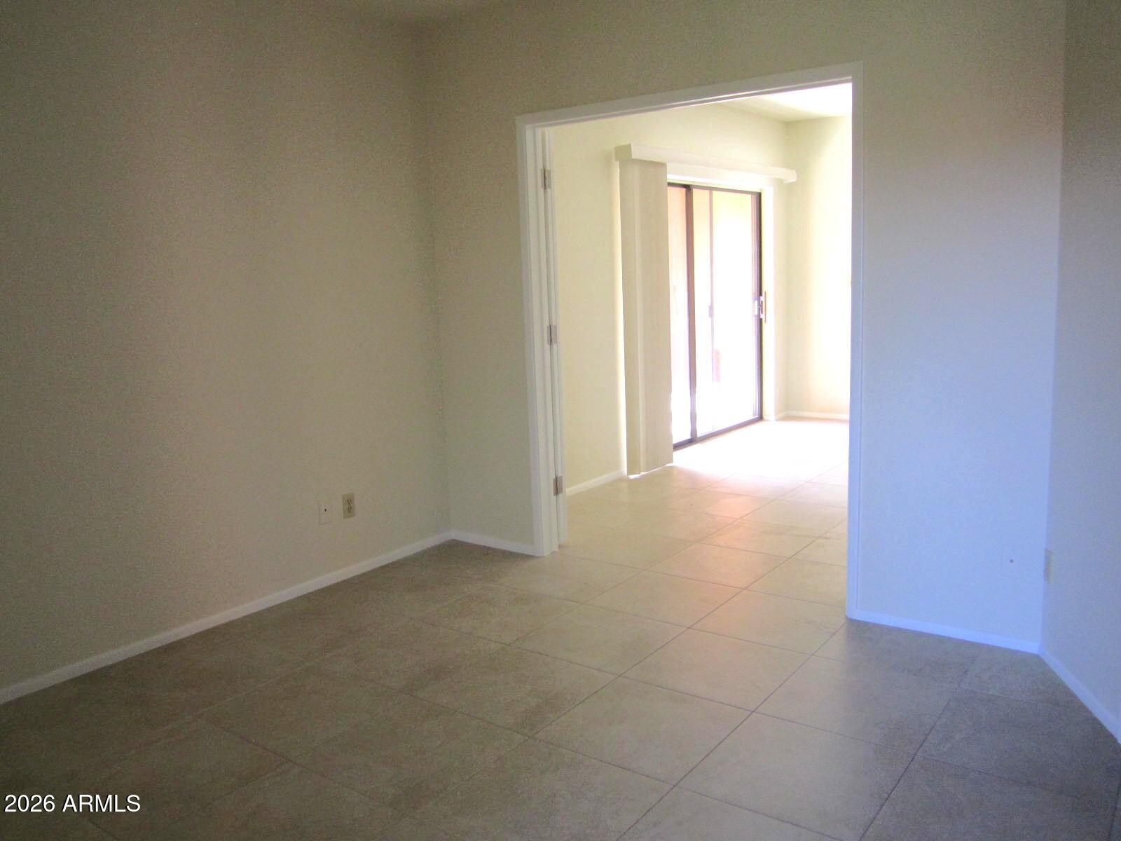 4303 East Cactus Road, Unit 419 Phoenix, AZ 85032 - Photo 13 of 34 a view of an empty room and window