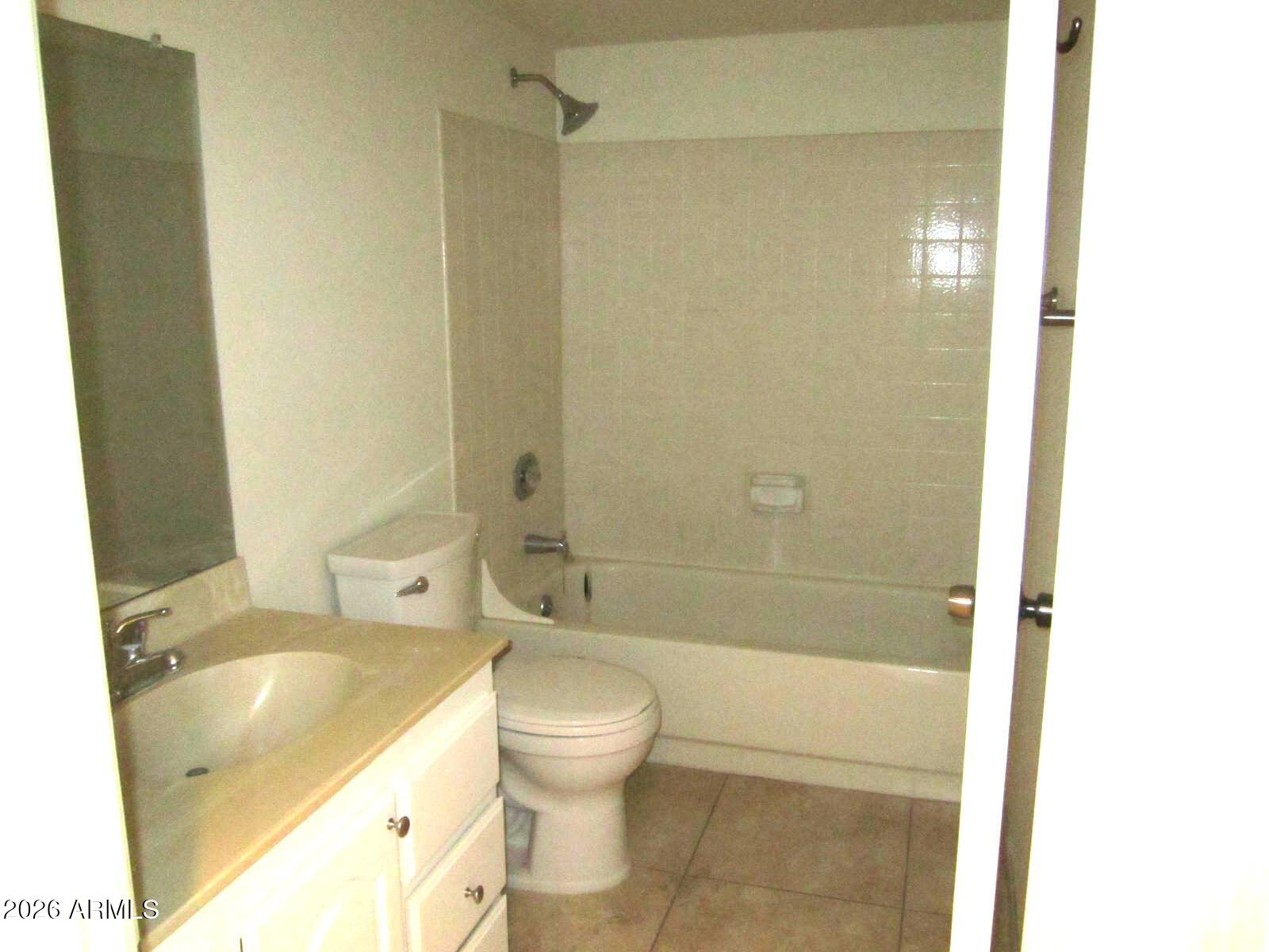 4303 East Cactus Road, Unit 419 Phoenix, AZ 85032 - Photo 15 of 34 a bathroom with a sink and a bathtub