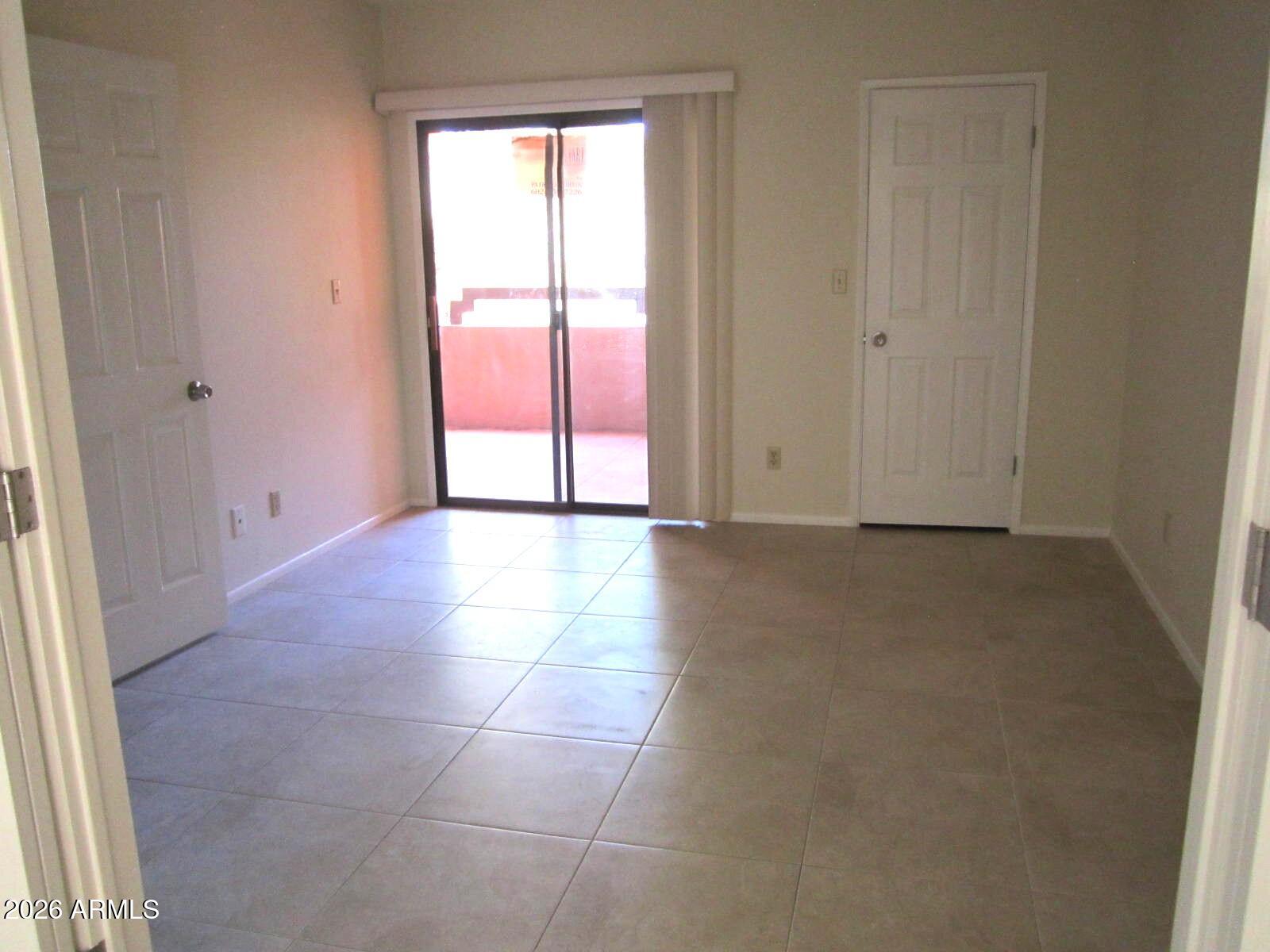 4303 East Cactus Road, Unit 419 Phoenix, AZ 85032 - Photo 16 of 34 a view of an empty room and window