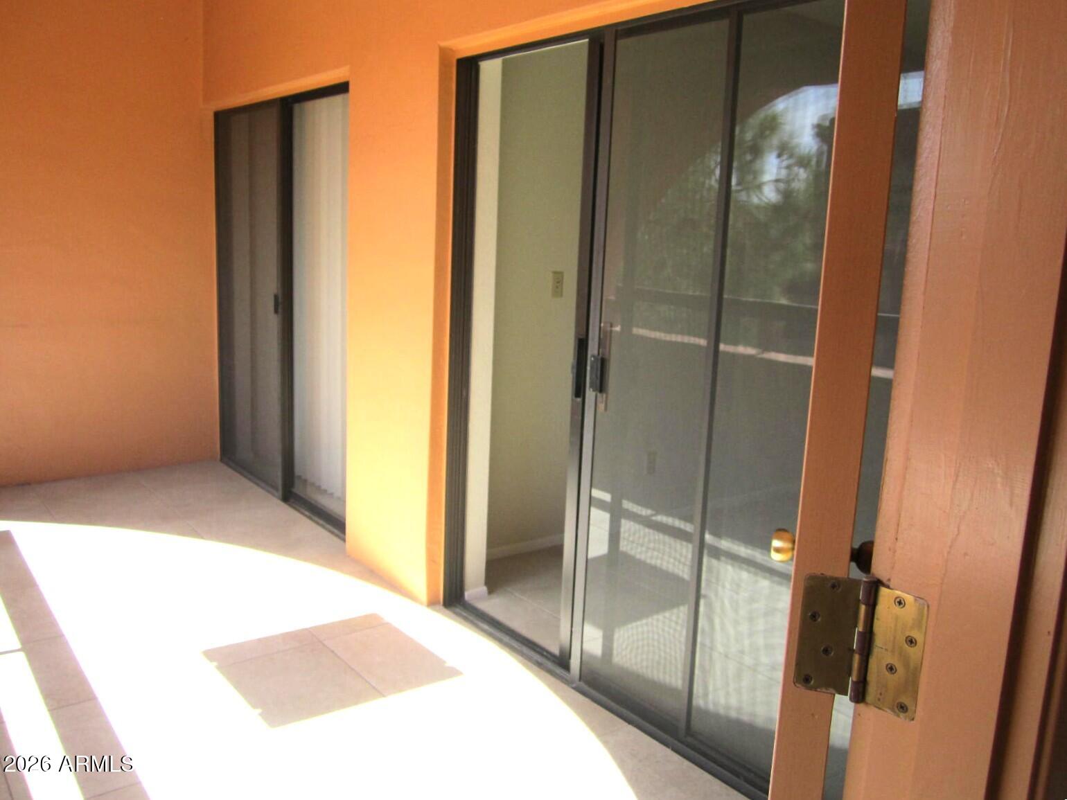 4303 East Cactus Road, Unit 419 Phoenix, AZ 85032 - Photo 17 of 34 a bathroom with a glass shower door