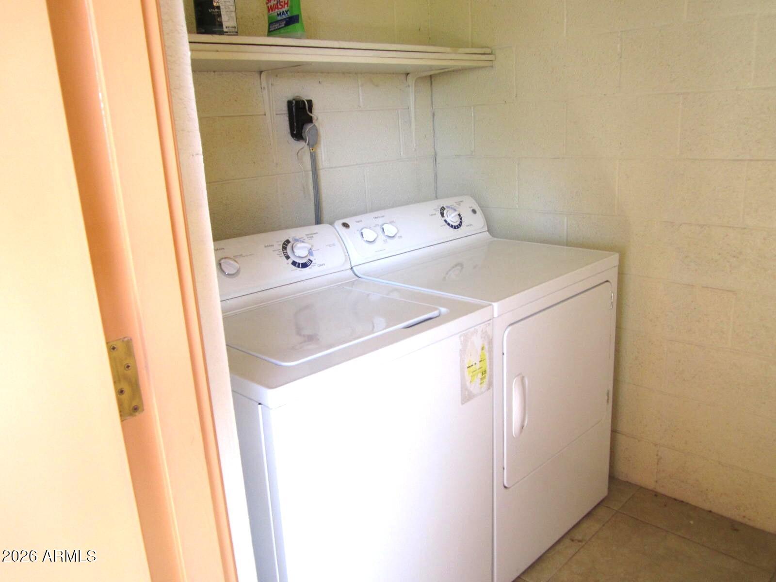 4303 East Cactus Road, Unit 419 Phoenix, AZ 85032 - Photo 18 of 34 a utility room with dryer and washer