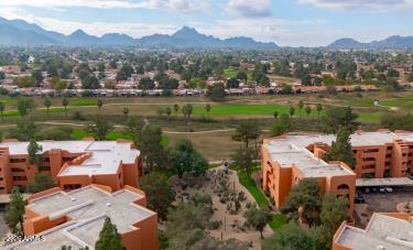 4303 East Cactus Road, Unit 419 Phoenix, AZ 85032 - Photo 26 of 34 an aerial view of a house with a lake view