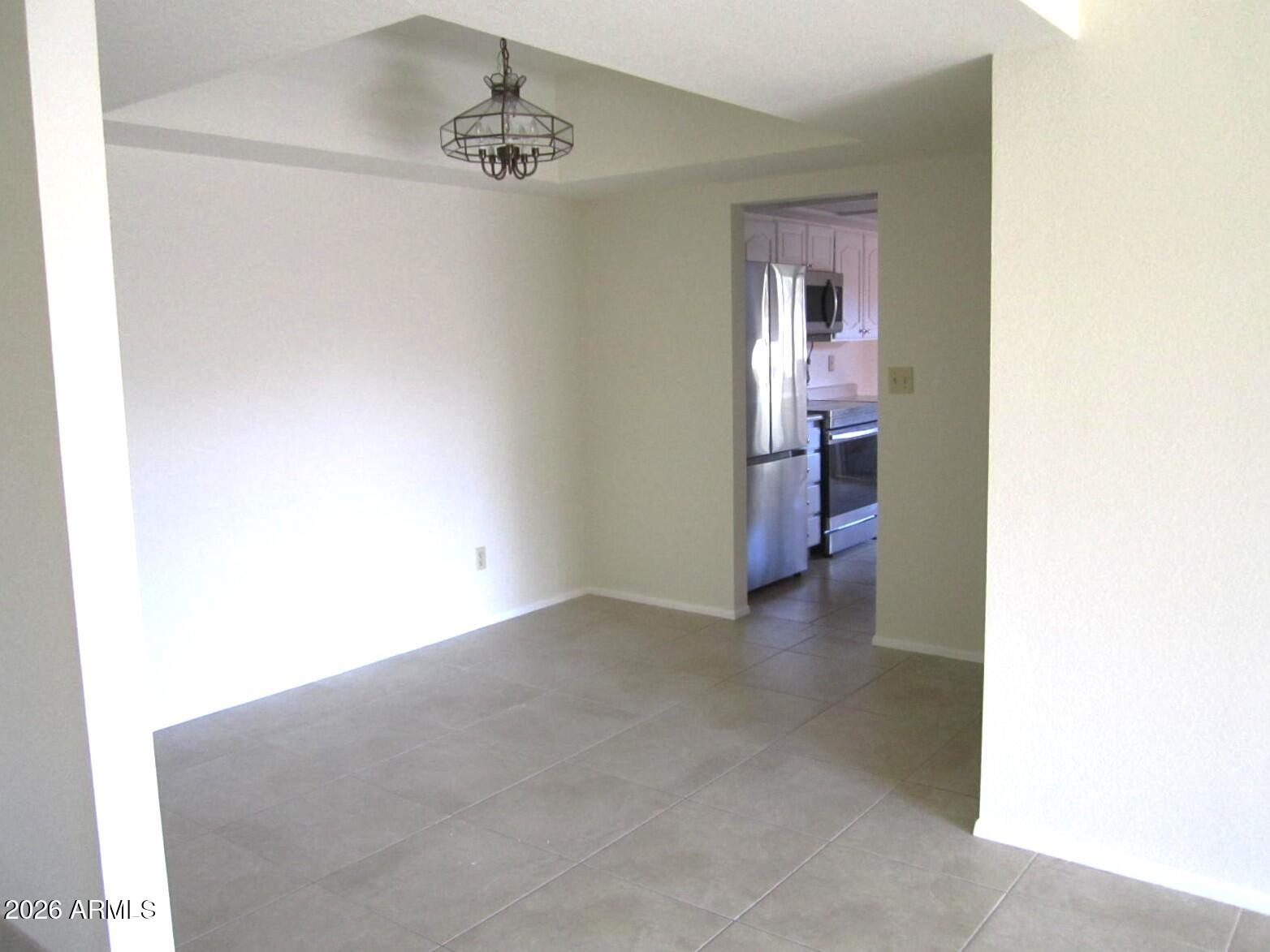 4303 East Cactus Road, Unit 419 Phoenix, AZ 85032 - Photo 6 of 34 a view of a hallway to a room with a bathroom