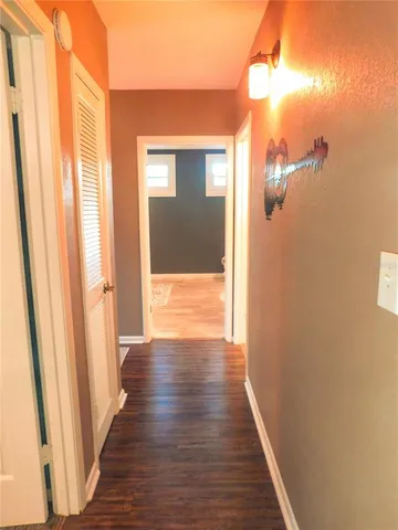 a view of a bathroom from a hallway