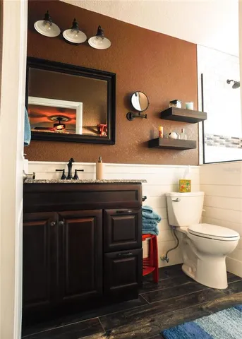 a bathroom with a sink and a toilet