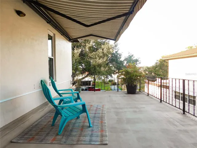 a view of a chairs and table in the patio