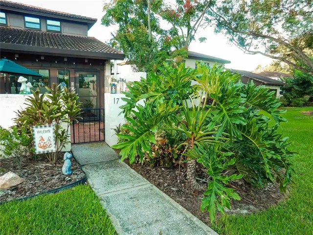 a view of a house with a tree